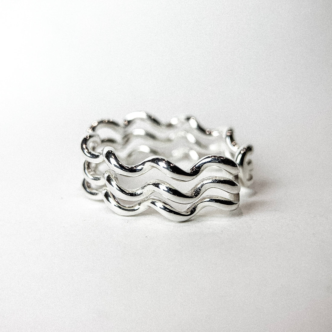 OPEN TRIPLE TWIST SILVER RING