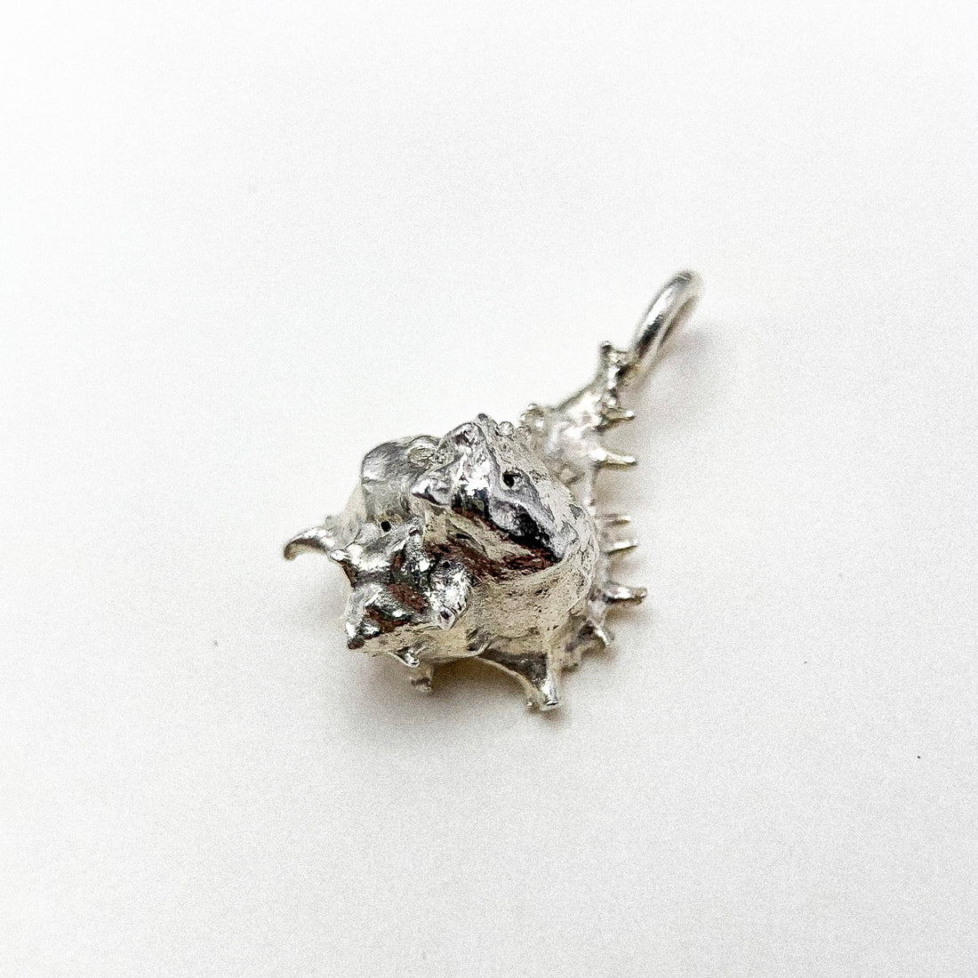 SPIKED SHELL SILVER PENDANT